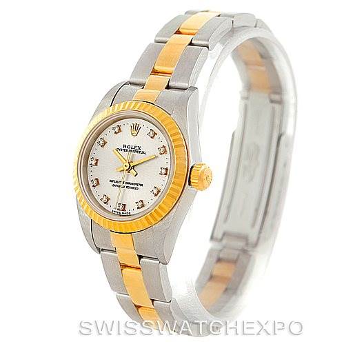 This image showcases a Rolex Oyster Perpetual 76193 Women's Steel and Gold (two tone) Silver Dial 76193 Women's Steel and Gold (two tone) Silver Dial watch from a front-right angle, highlighting its bezel, face, and bracelet.