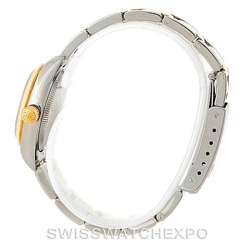 This image shows a side view of the Rolex Oyster Perpetual 76193 Women's Steel and Gold (two tone) Silver Dial 76193 Women's Steel and Gold (two tone) Silver Dial watch, highlighting the crown, bezel, and bracelet.