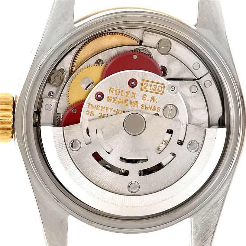 The image shows the internal mechanism and rotor of a Rolex Oyster Perpetual 67193 Women's Steel and Gold (two tone) Black Dial 67193 Women's Steel and Gold (two tone) Black Dial watch at a close-up angle.