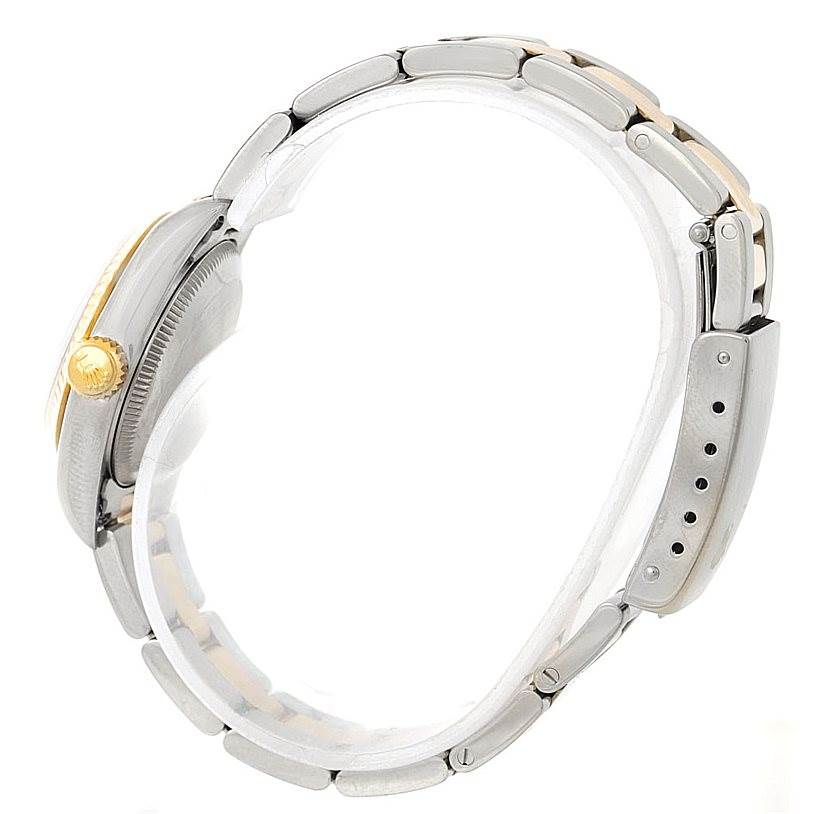 The image shows a side view of a Rolex Oyster Perpetual 67193 Women's Steel and Gold (two tone) Black Dial 67193 Women's Steel and Gold (two tone) Black Dial watch, focusing on its case, crown, and bracelet.