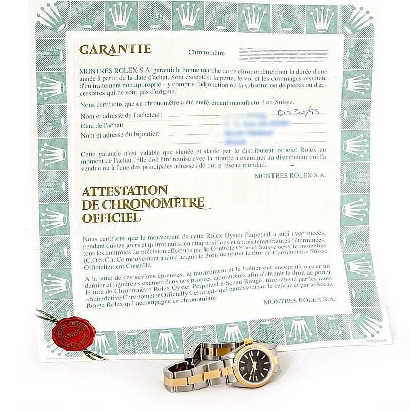 The image shows a Rolex Oyster Perpetual 67193 Women's Steel and Gold (two tone) Black Dial 67193 Women's Steel and Gold (two tone) Black Dial watch along with its warranty certificate.