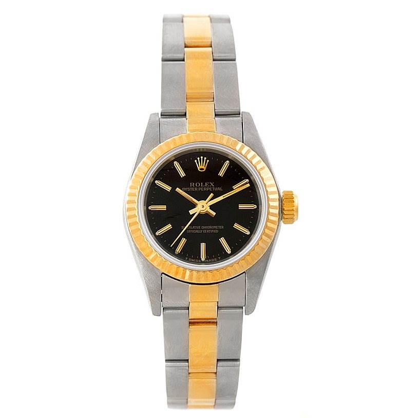 The image shows a Rolex Oyster Perpetual 67193 Women's Steel and Gold (two tone) Black Dial 67193 Women's Steel and Gold (two tone) Black Dial watch from a top-down angle, displaying its two-tone band and black dial.