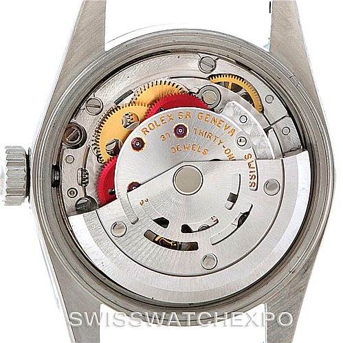 This image shows the inner mechanism of the Rolex Oyster Perpetual 76030 Women's Stainless Steel Silver Dial 76030 Women's Stainless Steel Silver Dial watch, highlighting its intricate gears and components.