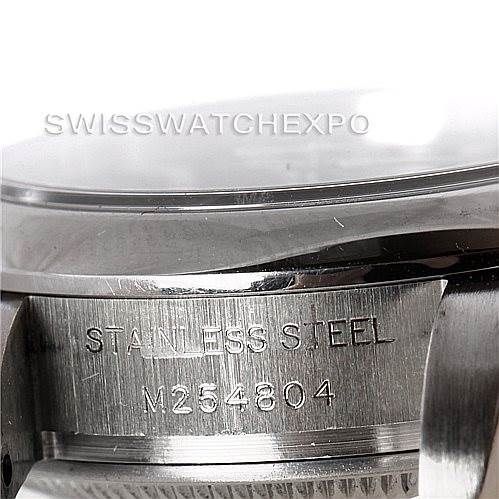 This image of a Rolex Oyster Perpetual 176200 Women's Stainless Steel Black Dial 176200 Women's Stainless Steel Black Dial watch shows a close-up view of the side of the casing, highlighting the stainless steel material and serial number.