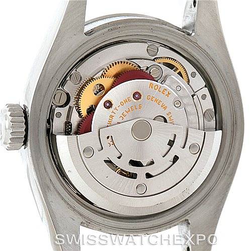 This image shows the back view of the Rolex Oyster Perpetual 176200 Women's Stainless Steel Black Dial 176200 Women's Stainless Steel Black Dial watch, revealing its exposed mechanical movement and rotor.