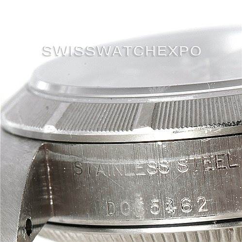 This image shows a close-up of the side of a Rolex Oyster Perpetual 76030 Women's Stainless Steel Pink Dial 76030 Women's Stainless Steel Pink Dial watch, highlighting the stainless steel case and serial number.