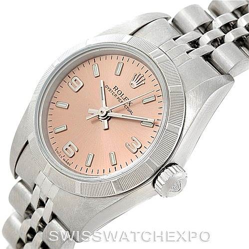 This image shows a Rolex Oyster Perpetual 76030 Women's Stainless Steel Pink Dial 76030 Women's Stainless Steel Pink Dial watch at a slight angle, highlighting the face, bezel, crown, and part of the metal bracelet.