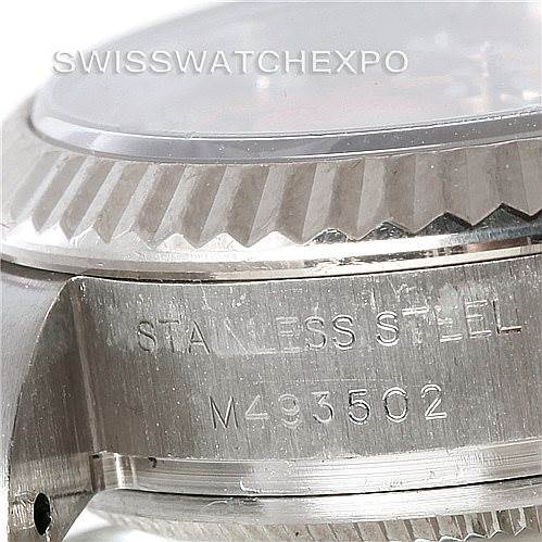 This image shows a close-up of the side of a Rolex Oyster Perpetual 176234 Women's Stainless Steel Pink Dial 176234 Women's Stainless Steel Pink Dial watch, highlighting the stainless steel case and engraving.