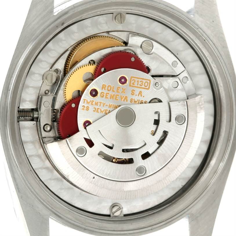 The image shows the internal mechanism of a Rolex Oyster Perpetual 67180 Women's Stainless Steel Black Dial 67180 Women's Stainless Steel Black Dial watch from the back.