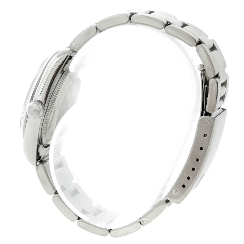 The image shows a side view of the Rolex Oyster Perpetual 67180 Women's Stainless Steel Black Dial 67180 Women's Stainless Steel Black Dial watch, focusing on the crown, case, and bracelet.