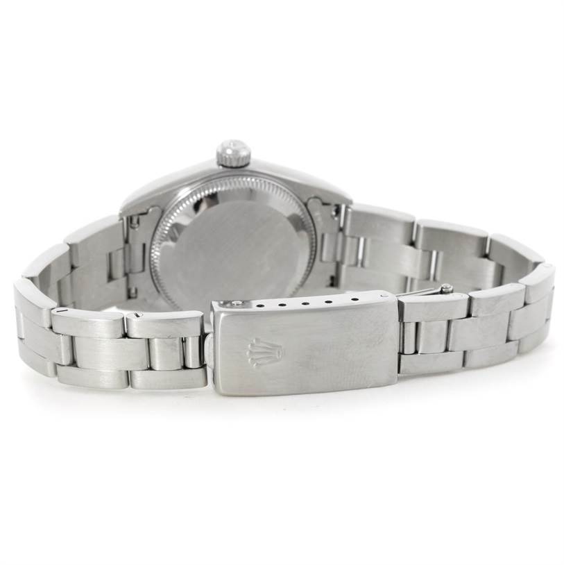 The image shows the back view of a Rolex Oyster Perpetual 76080 Women's Stainless Steel Pink Dial 76080 Women's Stainless Steel Pink Dial watch, highlighting the clasp, bracelet, and case back.