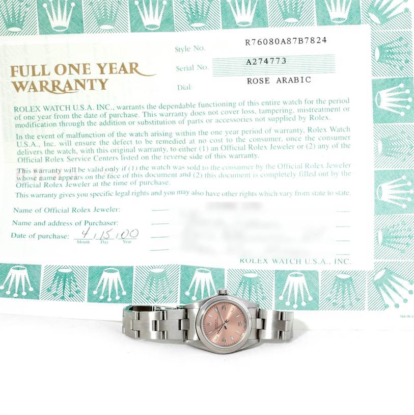 The image shows a Rolex Oyster Perpetual 76080 Women's Stainless Steel Pink Dial 76080 Women's Stainless Steel Pink Dial watch laid flat, accompanied by its official warranty document.