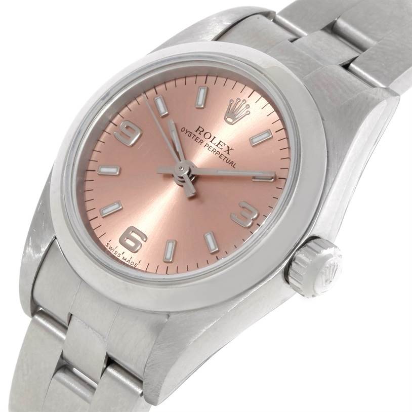 This image shows a close-up angle of the Rolex Oyster Perpetual 76080 Women's Stainless Steel Pink Dial 76080 Women's Stainless Steel Pink Dial watch featuring its dial, bezel, and bracelet.