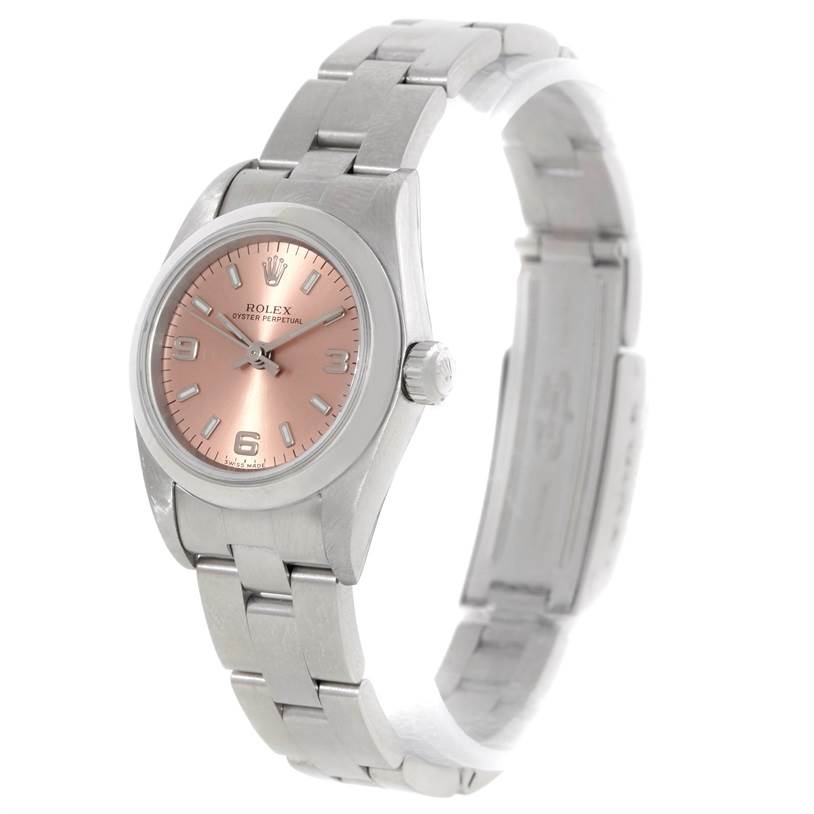 This Rolex Oyster Perpetual 76080 Women's Stainless Steel Pink Dial 76080 Women's Stainless Steel Pink Dial watch is shown at a slight angle, displaying its face, bracelet, and crown.