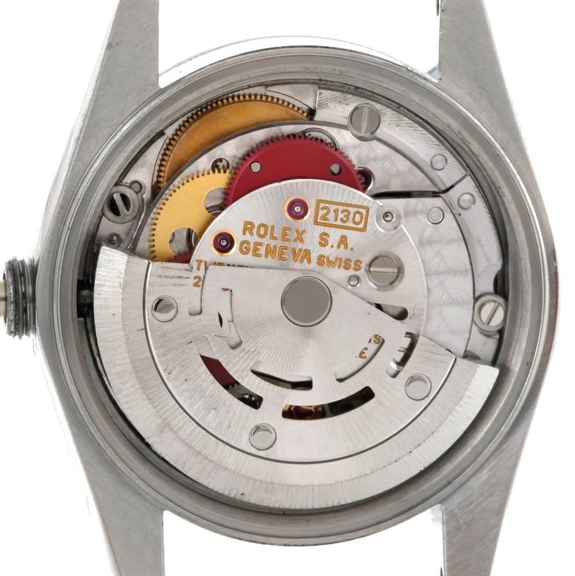 The image shows the inner mechanical movement parts of a Rolex Oyster Perpetual 67230 Women's Stainless Steel Blue Dial 67230 Women's Stainless Steel Blue Dial watch from a back angle.