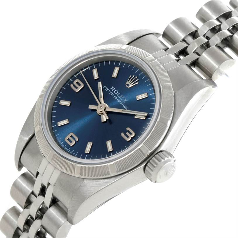 This image shows a close-up angled view of a Rolex Oyster Perpetual 67230 Women's Stainless Steel Blue Dial 67230 Women's Stainless Steel Blue Dial watch, focusing on the dial, case, and part of the bracelet.