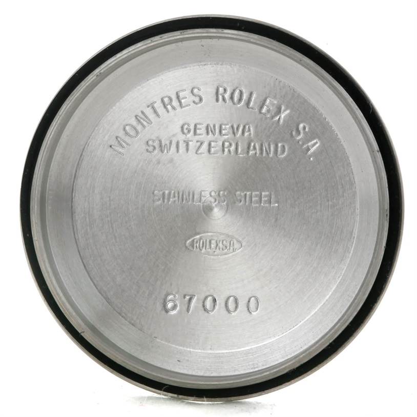 The image shows the inner case back of the Rolex Oyster Perpetual 67230 Women's Stainless Steel Blue Dial 67230 Women's Stainless Steel Blue Dial watch, featuring model number 67000.