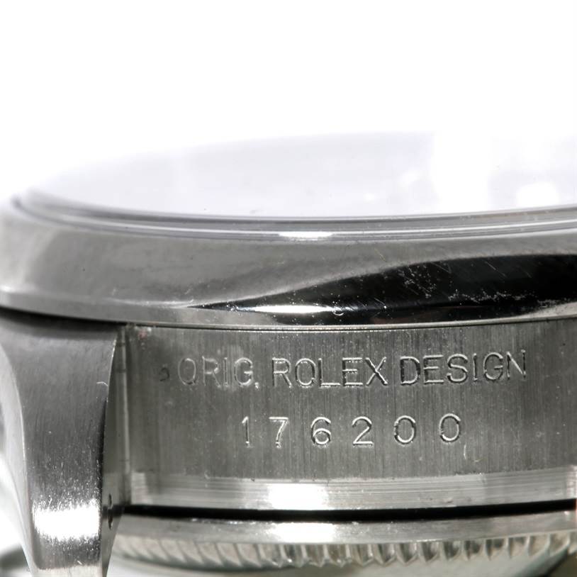 This image shows a close-up side view of the case of the Rolex Oyster Perpetual 176200 Women's Stainless Steel White Dial 176200 Women's Stainless Steel White Dial watch, highlighting the model number "176200" and "ORIG. ROLEX DESIGN" engraving.