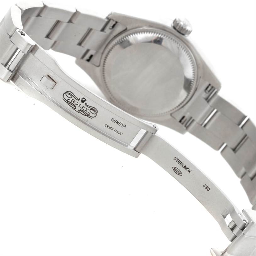The image shows the backside and bracelet clasp of a Rolex Oyster Perpetual 176200 Women's Stainless Steel White Dial 176200 Women's Stainless Steel White Dial watch, including the engraving and mechanism.