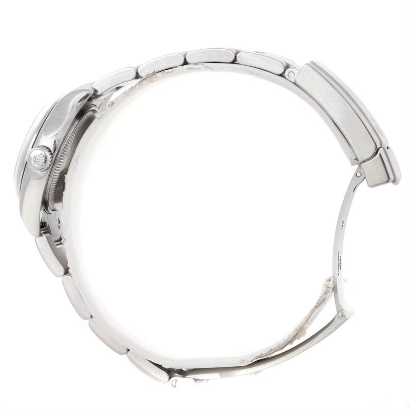 The image shows a side view of the Rolex Oyster Perpetual 176200 Women's Stainless Steel White Dial 176200 Women's Stainless Steel White Dial watch, focusing on the band and case, including the crown.