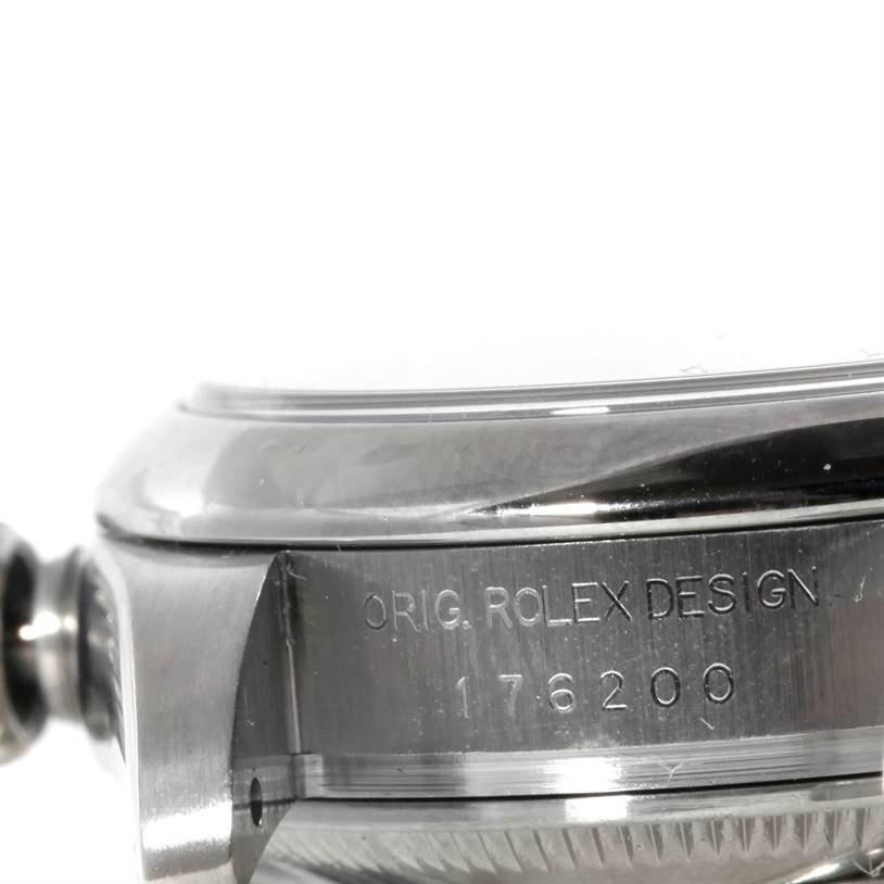 The image shows a close-up side view of the case, bezel, and the original design text with the model number of a Rolex Oyster Perpetual 176200 Women's Stainless Steel White Dial 176200 Women's Stainless Steel White Dial watch.