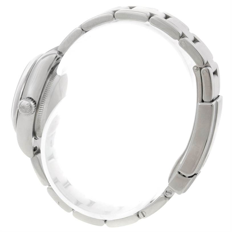 Side view of Rolex Oyster Perpetual 176200 Women's Stainless Steel White Dial 176200 Women's Stainless Steel White Dial watch showing the bracelet and crown.