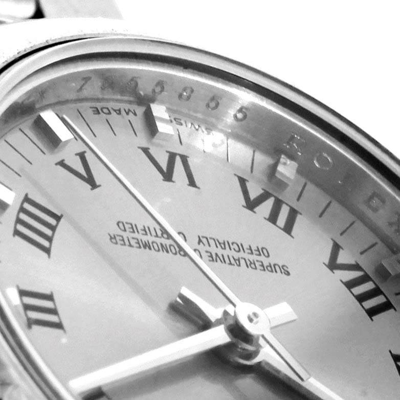 This image shows a close-up, angled view of the dial and bezel of a Rolex Oyster Perpetual 176200 Women's Stainless Steel Silver Dial 176200 Women's Stainless Steel Silver Dial watch.