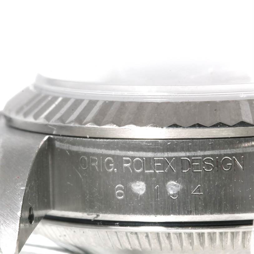 The image shows a close-up side view of the case and bezel of a Rolex Oyster Perpetual 67194 Women's Stainless Steel Pink Dial 67194 Women's Stainless Steel Pink Dial watch, with "ORIG. ROLEX DESIGN" engraved.