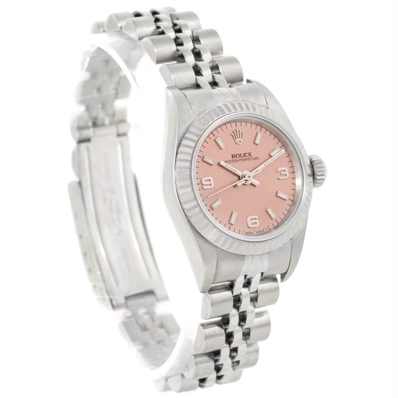 The image displays a Rolex Oyster Perpetual 67194 Women's Stainless Steel Pink Dial 67194 Women's Stainless Steel Pink Dial watch from an angled view showing its pink dial, case, and Jubilee bracelet.