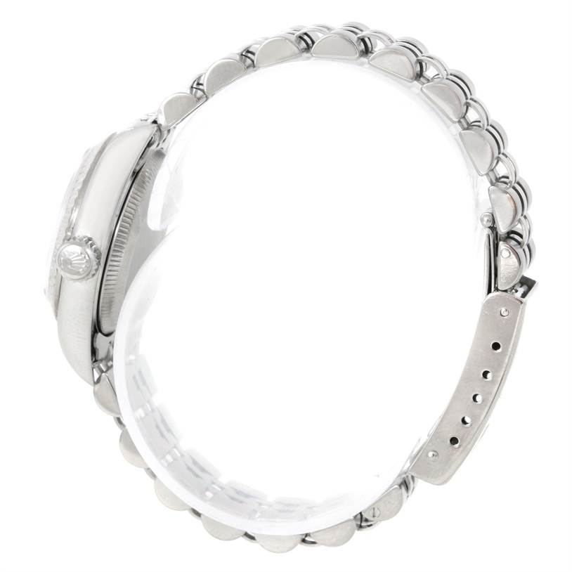 This image shows a side view of the Rolex Oyster Perpetual 67194 Women's Stainless Steel Pink Dial 67194 Women's Stainless Steel Pink Dial watch, highlighting its case, crown, and bracelet.