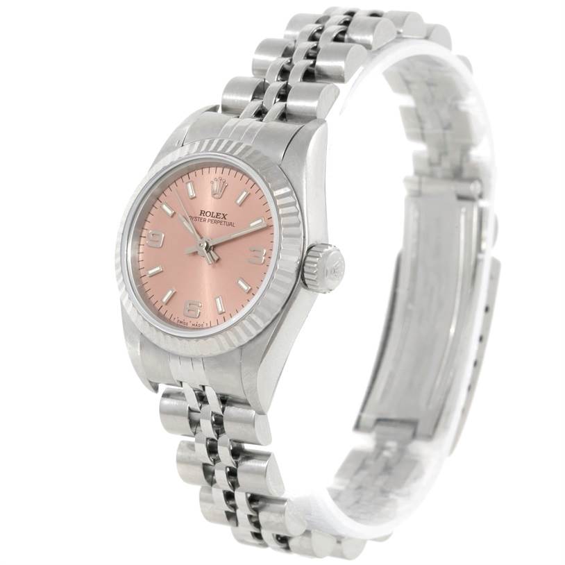 The image shows a side angle of a Rolex Oyster Perpetual 67194 Women's Stainless Steel Pink Dial 67194 Women's Stainless Steel Pink Dial watch with a pink dial and silver jubilee bracelet.