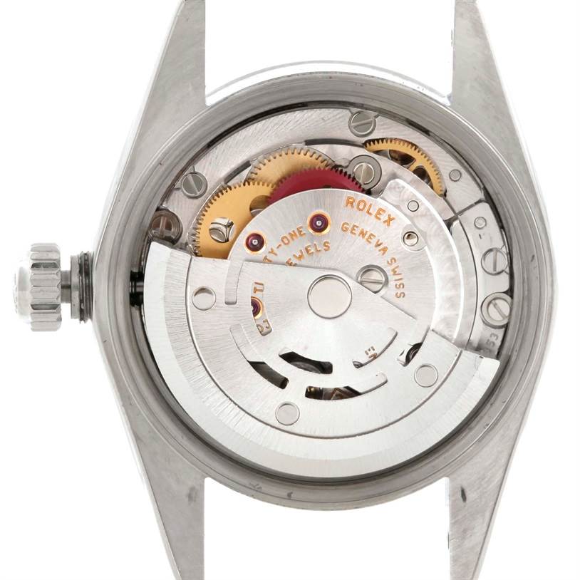 The image shows the internal mechanism and movement of a Rolex Oyster Perpetual 76080 Women's Stainless Steel Pink Dial 76080 Women's Stainless Steel Pink Dial watch from a rear open case angle.