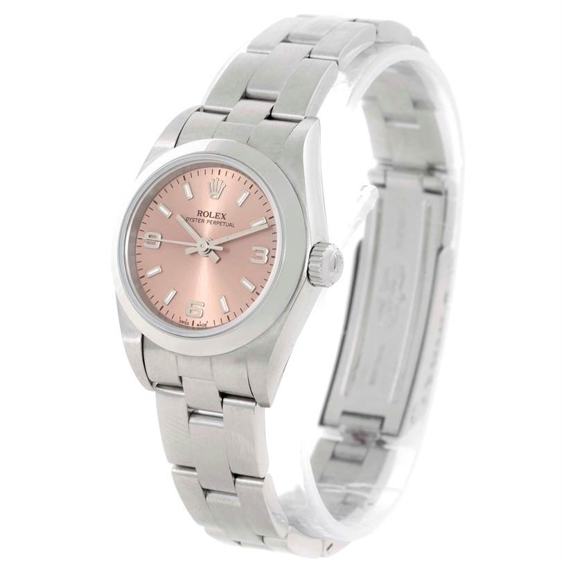 The image shows a Rolex Oyster Perpetual 76080 Women's Stainless Steel Pink Dial 76080 Women's Stainless Steel Pink Dial watch at a three-quarter angle, highlighting the face, bezel, and bracelet.