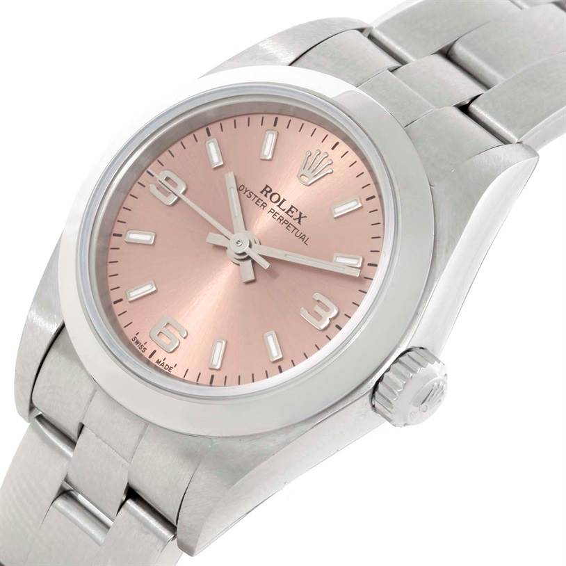This image shows a close-up angled view of the dial, case, crown, and part of the bracelet of a Rolex Oyster Perpetual 76080 Women's Stainless Steel Pink Dial 76080 Women's Stainless Steel Pink Dial watch.