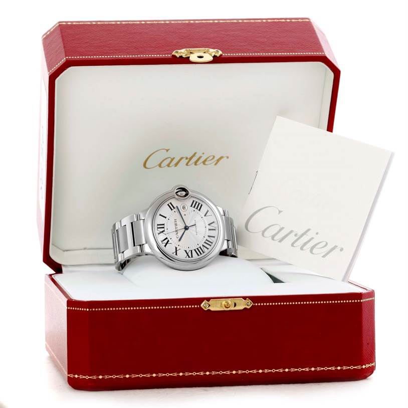 The Cartier Ballon Bleu W69012Z4 Men
s Stainless Steel Silver Dial W69012Z4 Men
s Stainless Steel Silver Dial watch is displayed at a slight angle inside an open red Cartier box with accompanying documents.