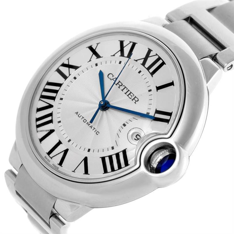 The image shows a close-up angle of the Cartier Ballon Bleu W69012Z4 Men
s Stainless Steel Silver Dial W69012Z4 Men
s Stainless Steel Silver Dial watch face and partial bracelet, highlighting the blue hands, Roman numerals, and cabochon crown.