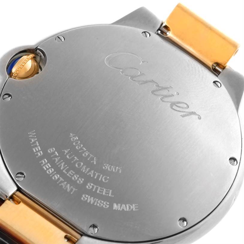 The image shows the back side of the Cartier Ballon Bleu 10524 Men's Stainless Steel Silver Dial 10524 Men's Stainless Steel Silver Dial watch, highlighting its casing and bracelet attachment.