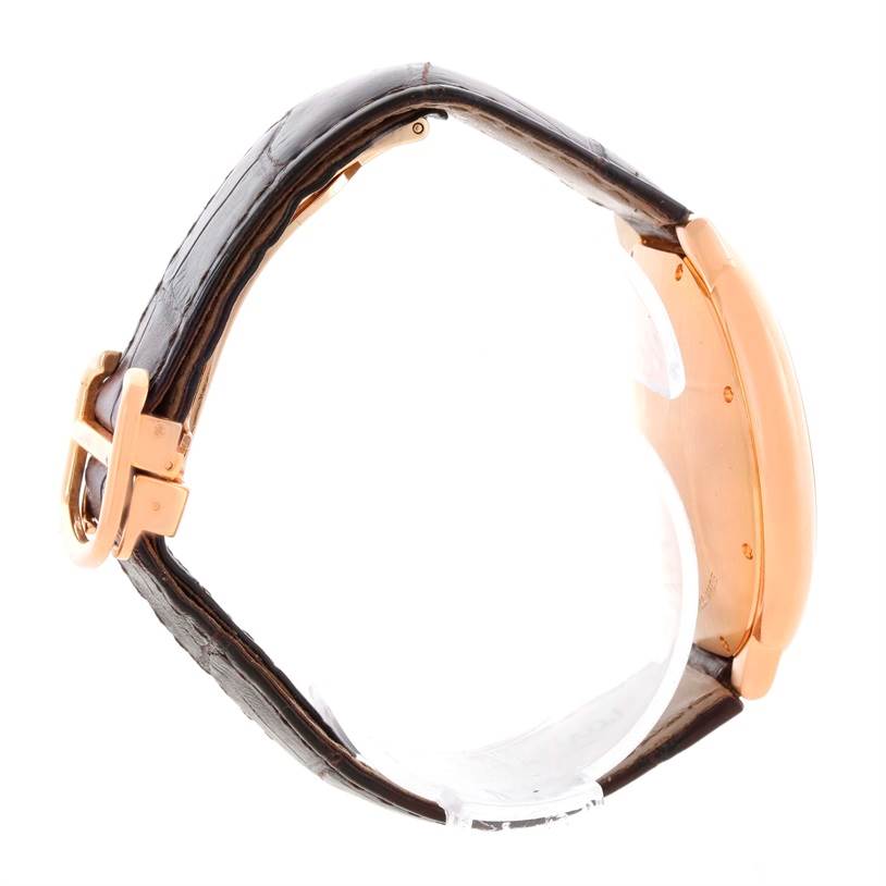 The image shows a side view of a Cartier Ballon Bleu W6920037 Men's Rose Gold Brown Dial W6920037 Men's Rose Gold Brown Dial watch, highlighting its rose gold case and brown leather strap with a buckle.