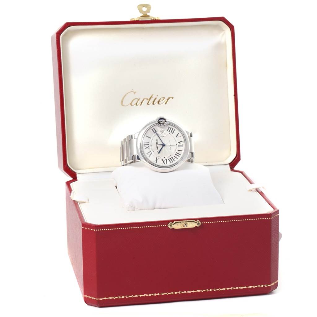 The Cartier Ballon Bleu W69012Z4 Men's Stainless Steel Silver Dial W69012Z4 Men's Stainless Steel Silver Dial watch is shown from the front, resting on a pillow inside an open Cartier box.