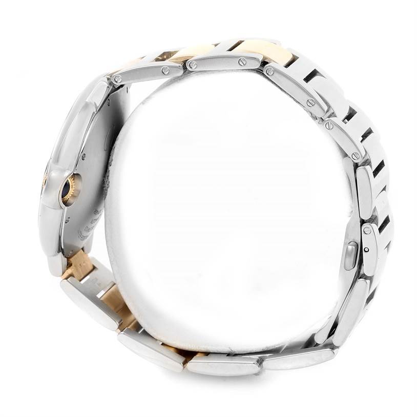 The image shows a side view of a Ballon Bleu by Cartier watch, focusing on its bracelet, case, and crown.