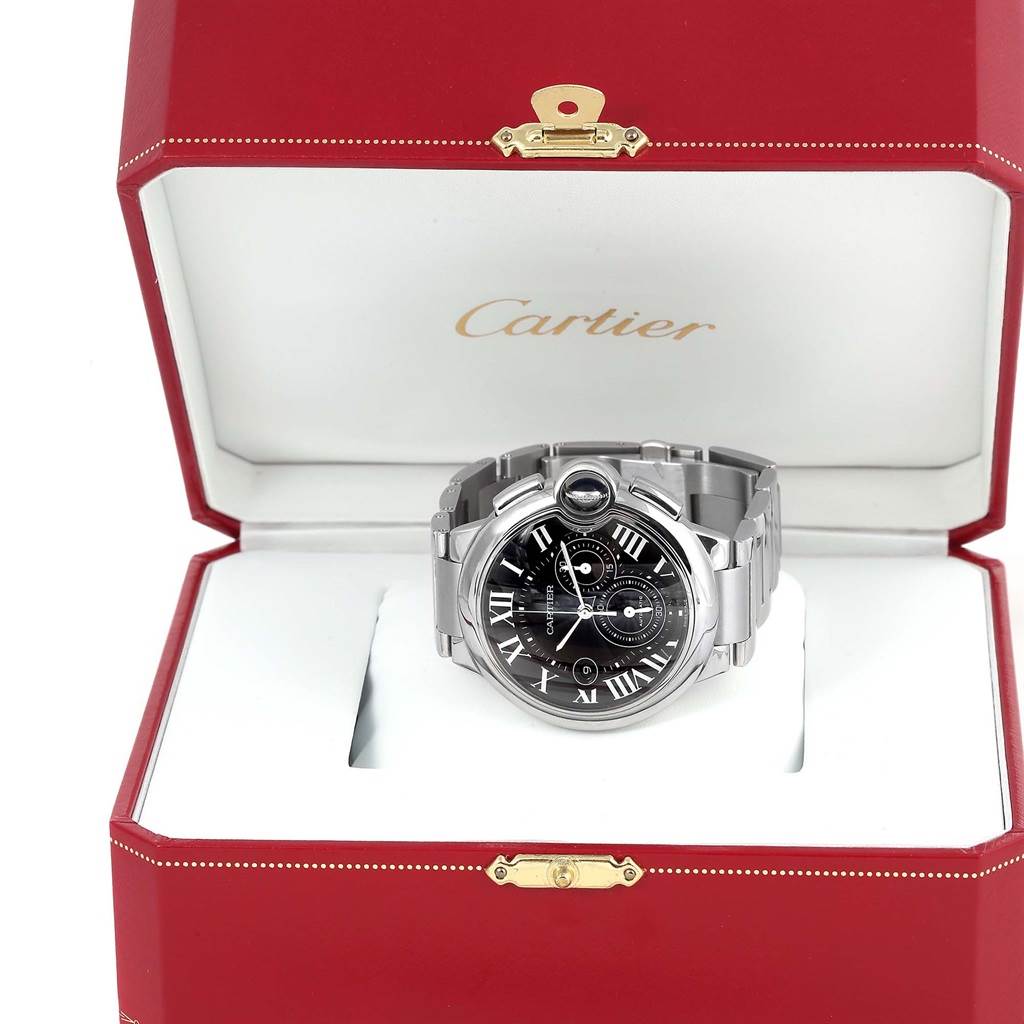 The image shows a Ballon Bleu model by Cartier, placed in an open red Cartier box, highlighting its face and bracelet.
