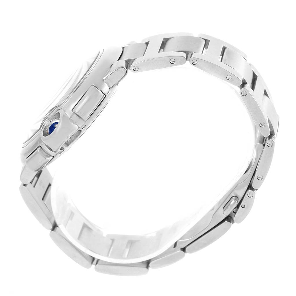 The photo shows a side view of the Cartier Ballon Bleu W6920002 Stainless Steel Silver Dial W6920002 Stainless Steel Silver Dial watch, highlighting its stainless steel bracelet and side profile with crown.