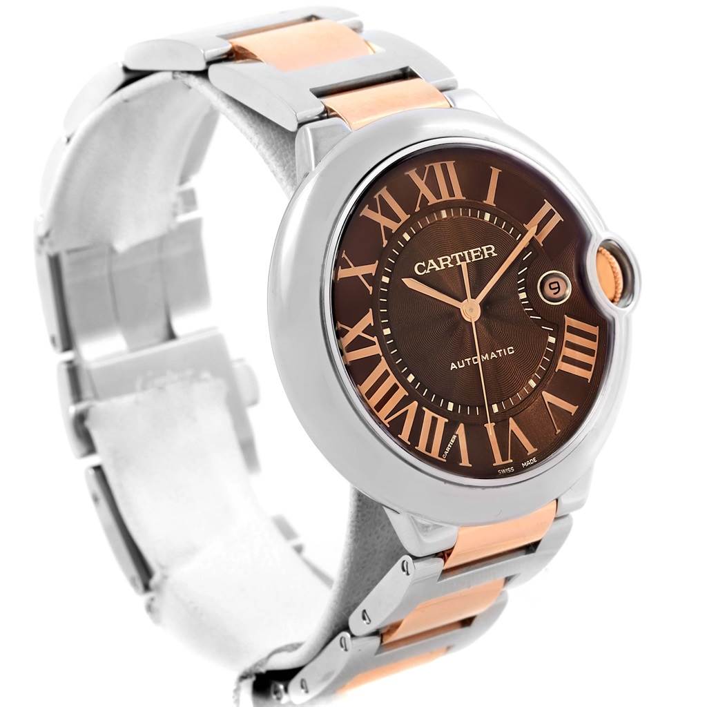 The image shows a close-up angled view of the face and metal strap of a Ballon Bleu model by Cartier.