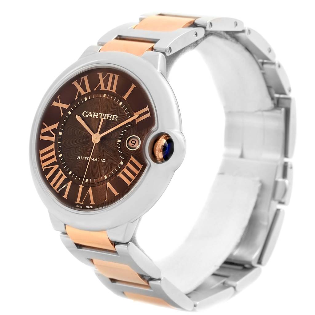 The image shows a Cartier Ballon Bleu W6920032 Steel and Gold (two tone) Brown Dial W6920032 Steel and Gold (two tone) Brown Dial watch at a three-quarter angle, highlighting its face, band, and crown.