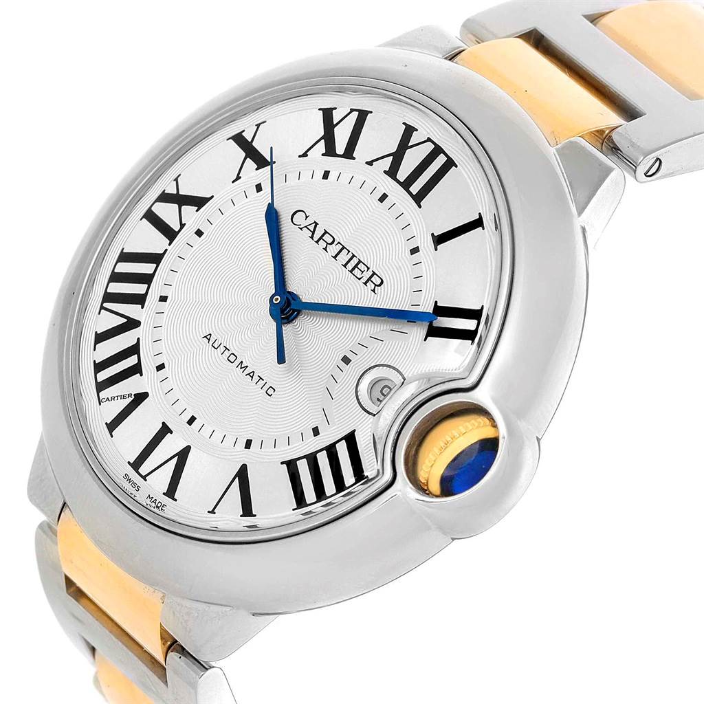 The Ballon Bleu de Cartier watch is shown at a slight angle, highlighting the dial, crown, and part of the bracelet.