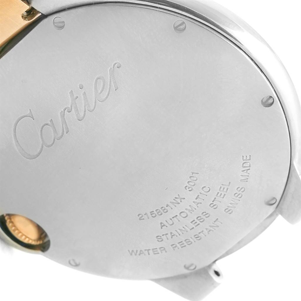 The image shows the back case of a Cartier Ballon Bleu W69009Z3 Men's Stainless Steel Silver Dial W69009Z3 Men's Stainless Steel Silver Dial watch from a close-up angle, highlighting the engraved details and screws.