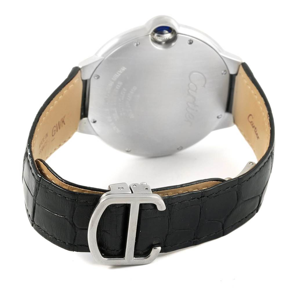 The image shows the back case and black leather strap of the Ballon Bleu model by Cartier, highlighting the buckle and rear casing details.