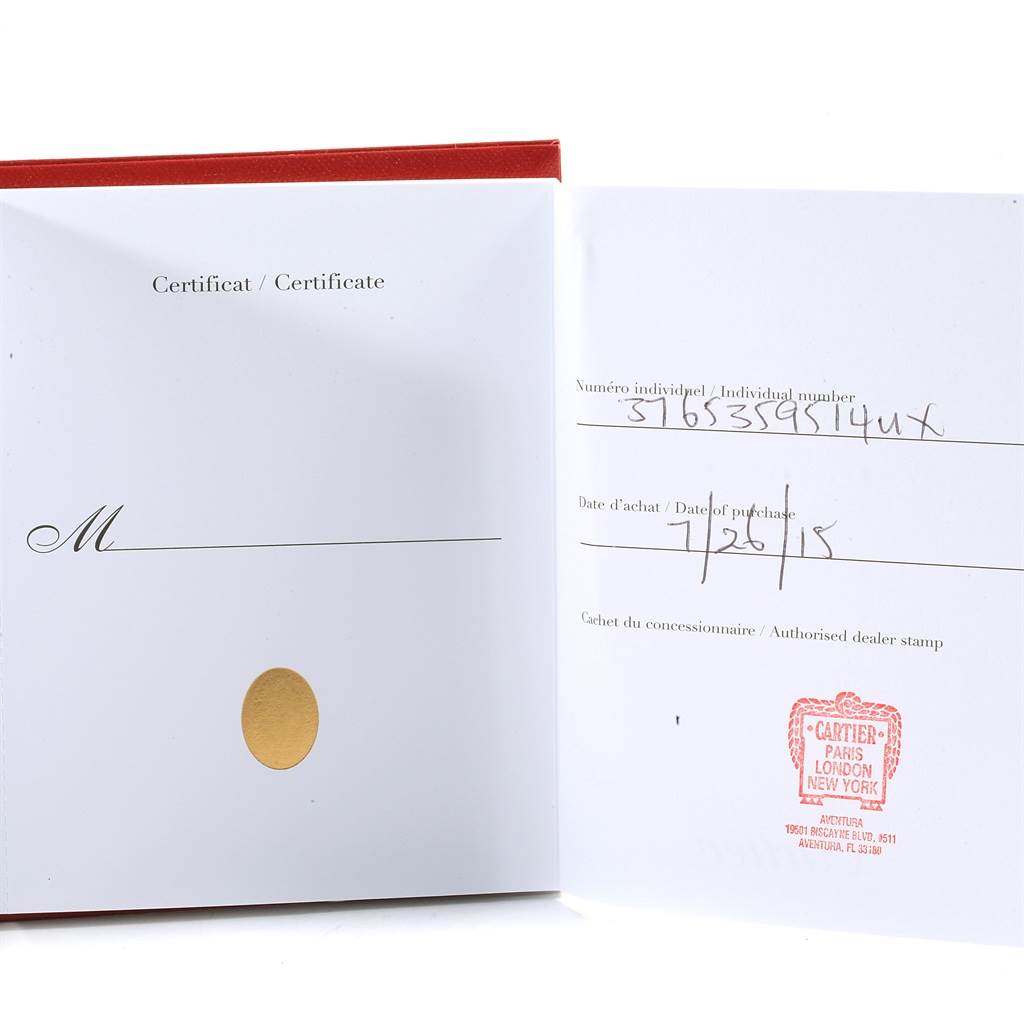 This image shows an open warranty certificate for a Ballon Bleu model by Cartier, with individual number, date of purchase, and dealer stamp.