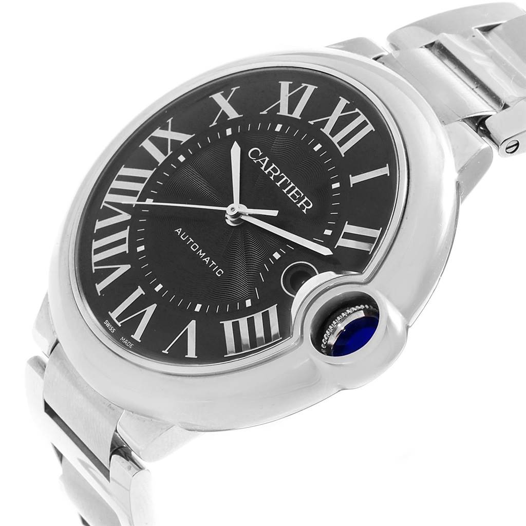The image shows a close-up of the Cartier Ballon Bleu W6920042 Men's Stainless Steel Black Dial W6920042 Men's Stainless Steel Black Dial watch face and part of the bracelet, highlighting the crown and Roman numerals.