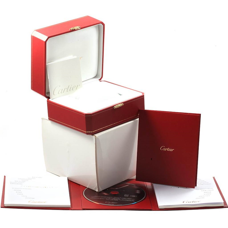 This image features the opened packaging and literature for a Ballon Bleu model by Cartier, including a box, booklet, and CD.